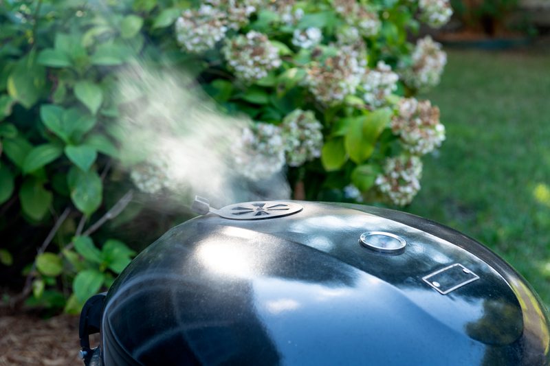 Does Food Cook Faster in a Charcoal Grill with the Lid Closed or Open?